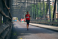 Photo of runner on bridge